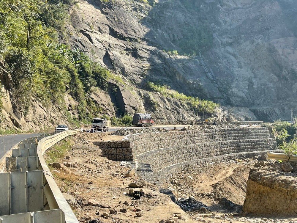 The status of repair works at the National Highway 29 stretch which was washed away by the Chathe River. (Morung Photo)